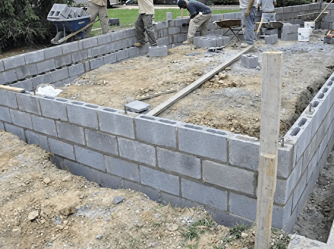 Professionals building a foundation with blocks in Providence, RI