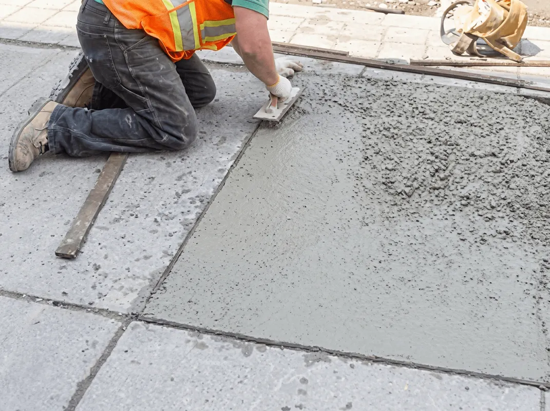 Professional repairing a concrete floor in Providence, RI